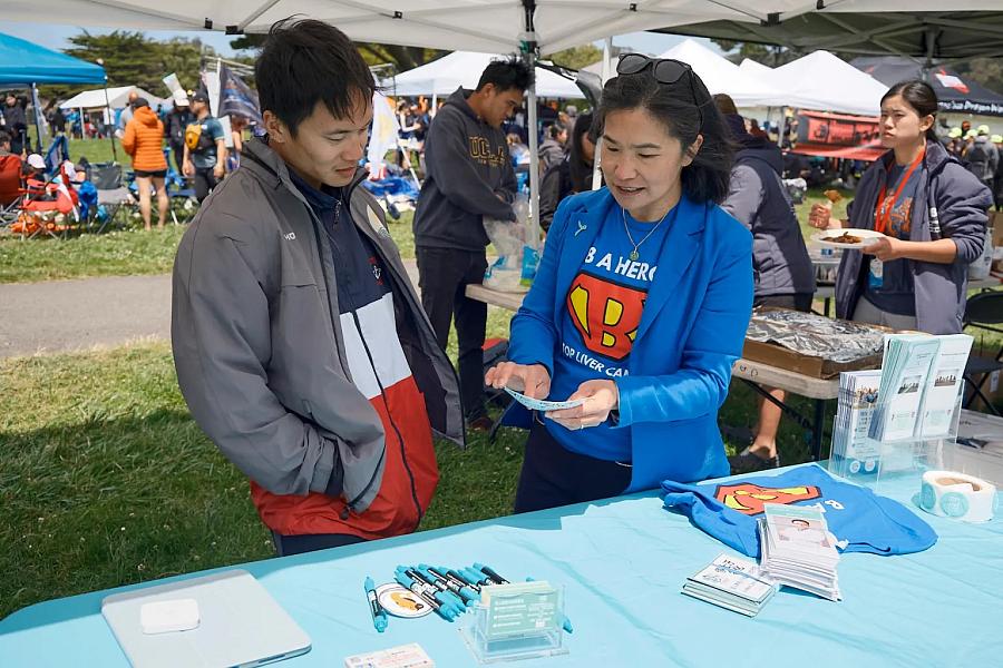 Two people at health camp interacting with one another