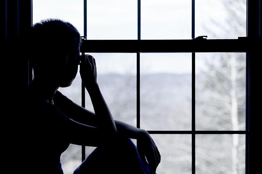 A person sitting by the window 
