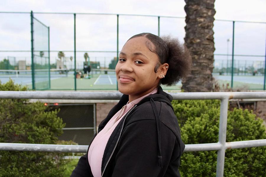 Lizette Pierce, 16, poses for a photo on the Lincoln High School campus in San Diego on Feb. 13, 2023. Throughout her pre-teen and teen years, she experienced adultification bias and anti-Blackness. (Anissa Durham/Word In Black)