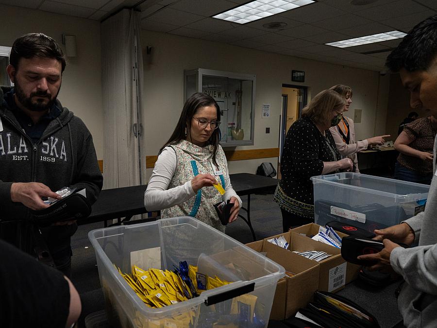 People assembling kits