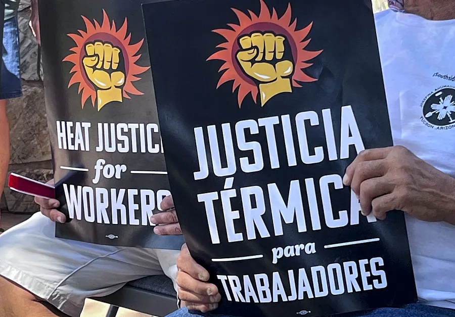 People holding two flyers