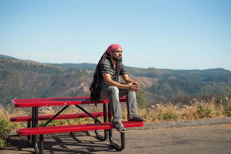 An image of a person sitting on bench