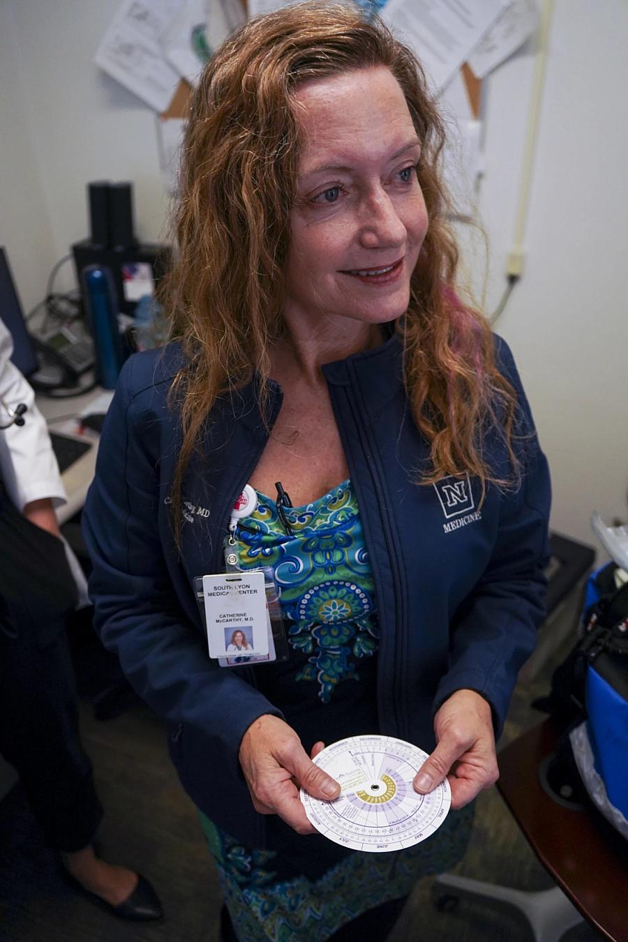 An image of a person holding CD