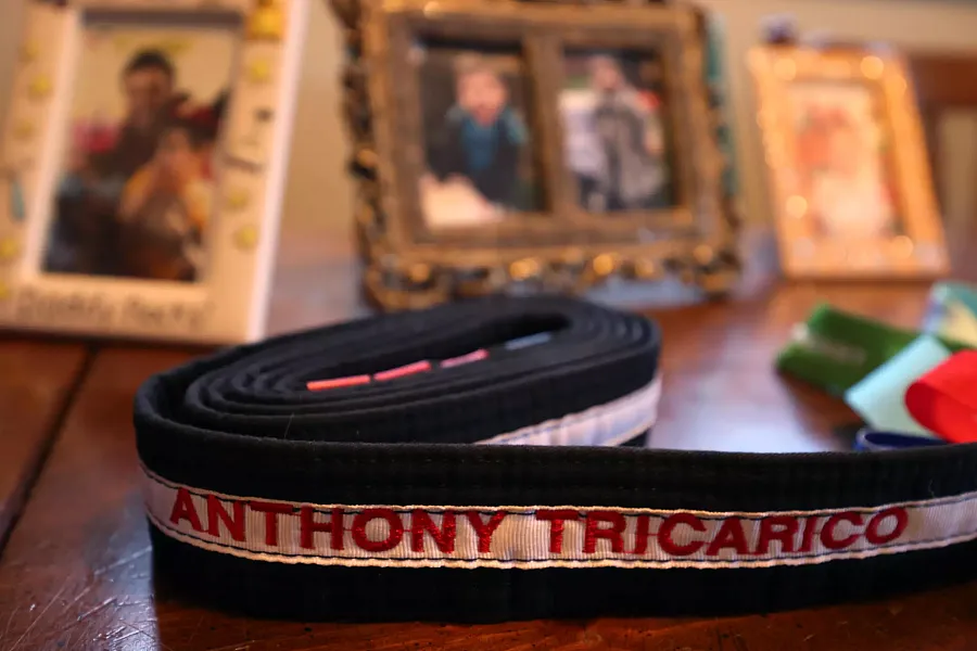 A belt with text on it against a few pictures 