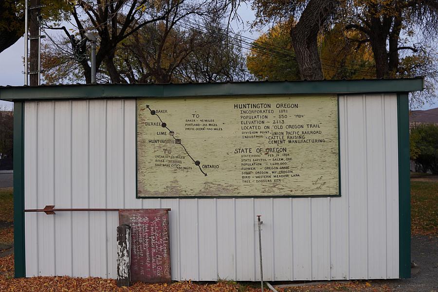 A roadside display board in Huntington, Oregon, showing a historical map and information about the town and the Oregon Trail.