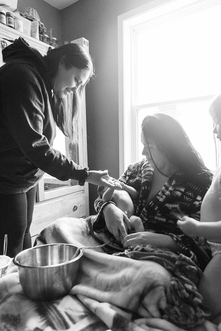 Person after giving birth at home to child 