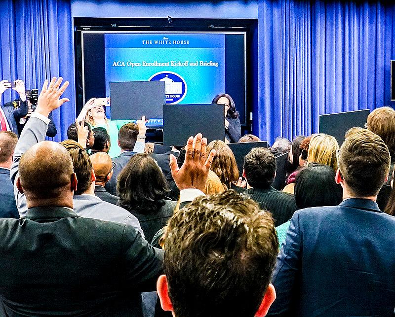 People raising their hand in a speech