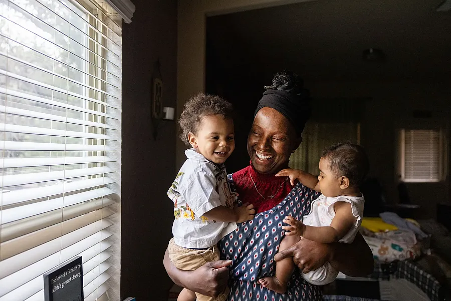 A person holding children