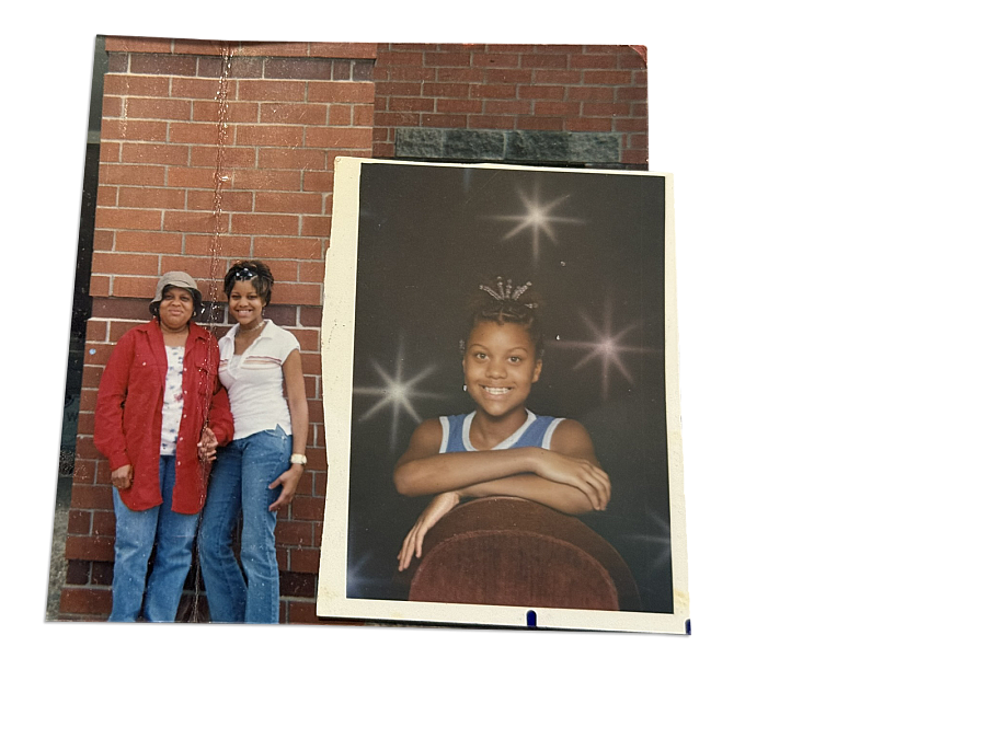 Person standing against a brick wall and a photo of a child besides