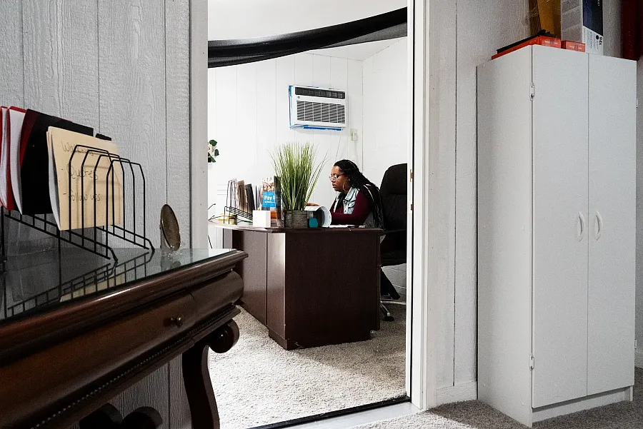 Person working on computer in a room