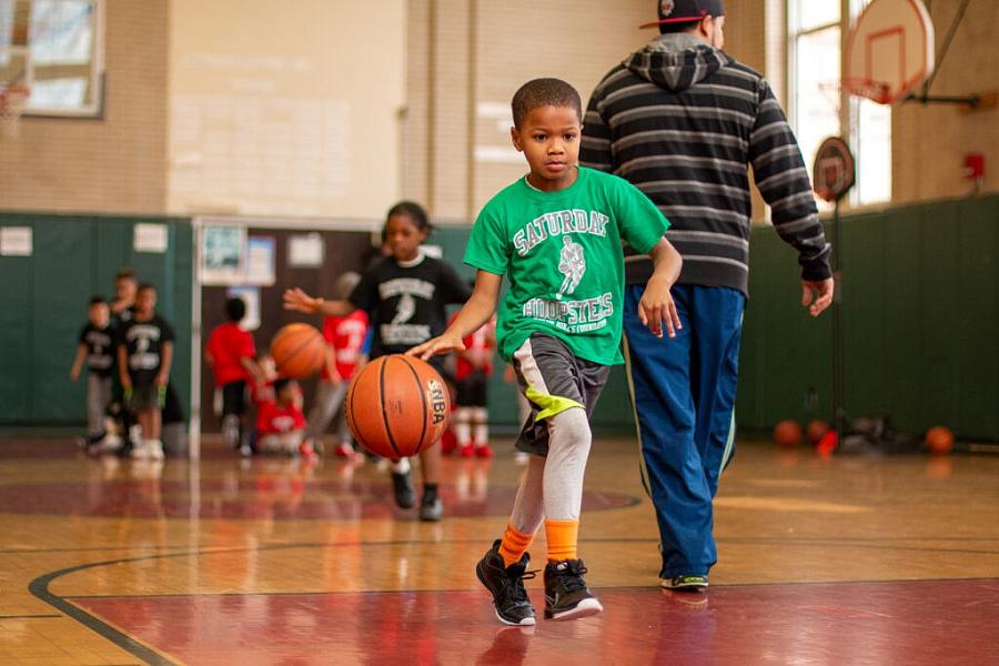 Image of a child playing basketball