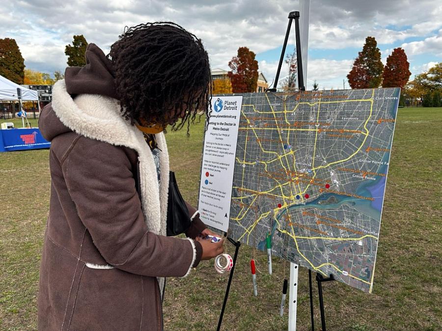 A person marking something on a map