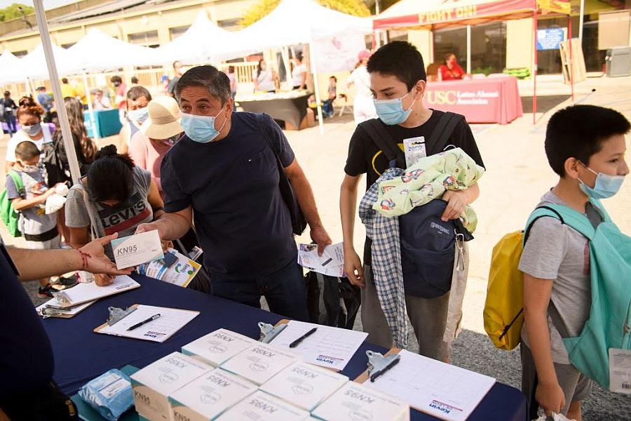 People collecting masks