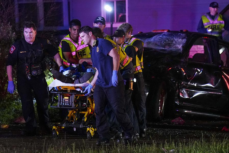 Image of paramedics and firefighters saving victim