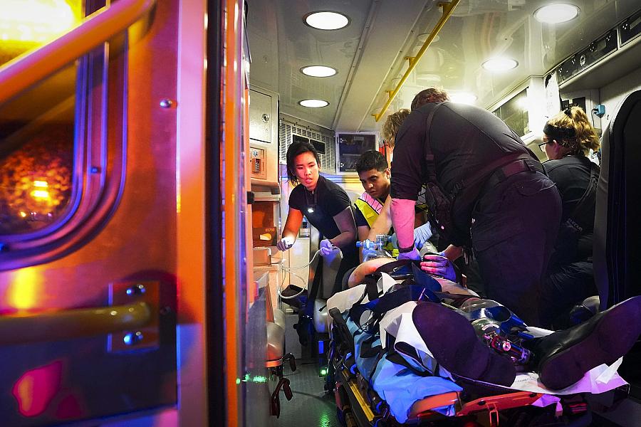 Image of paramedics and firefighters saving victim