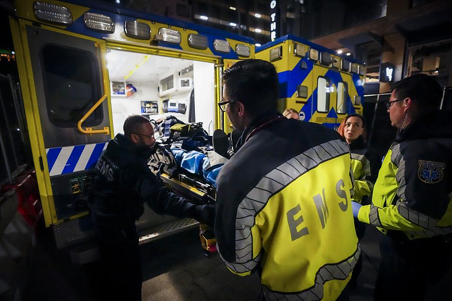 Image of paramedics and firefighters saving victim