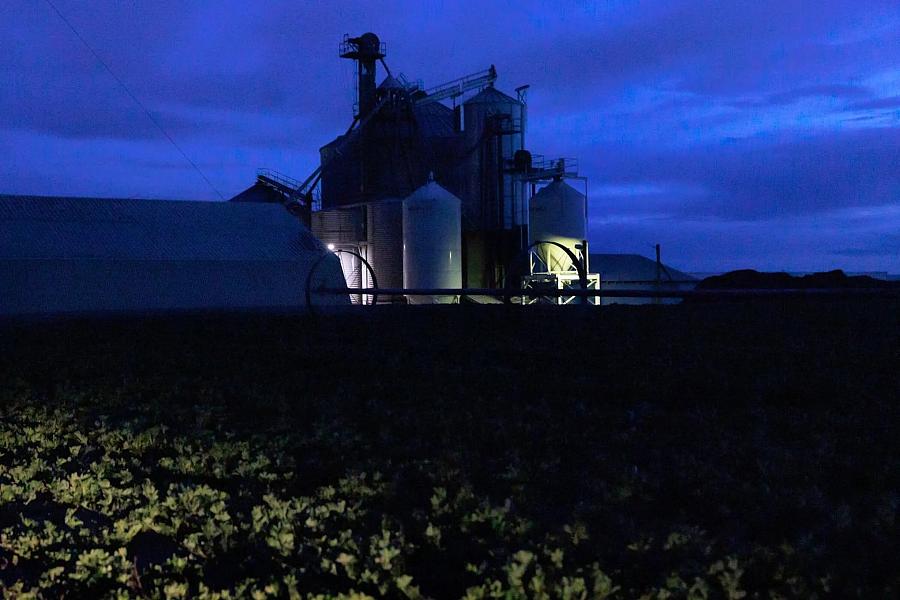 Night image of agricultural field and farming equipments