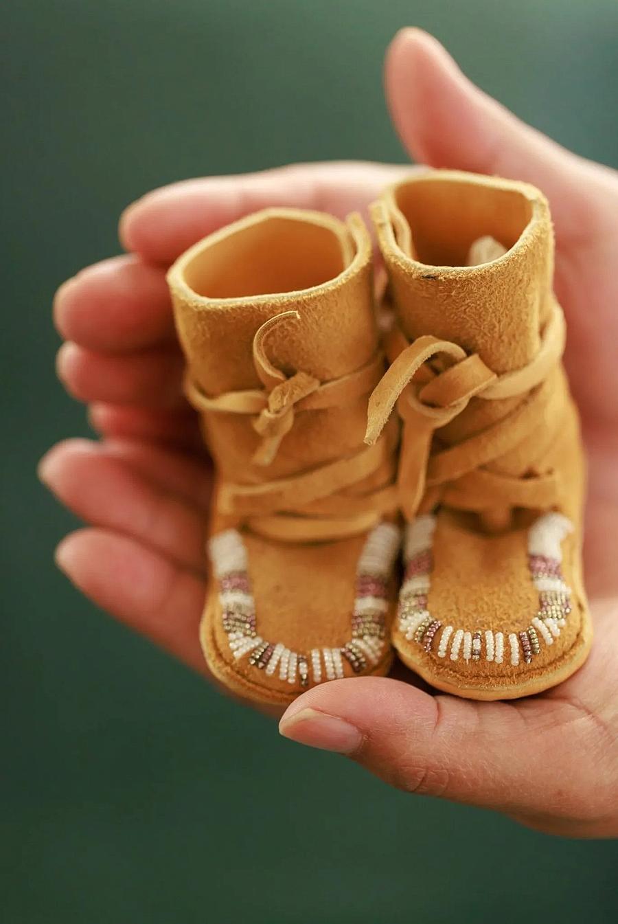 Image of small shoes in hands