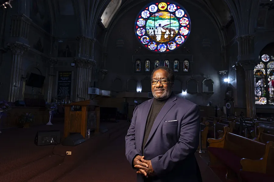 A person in a church with a coat