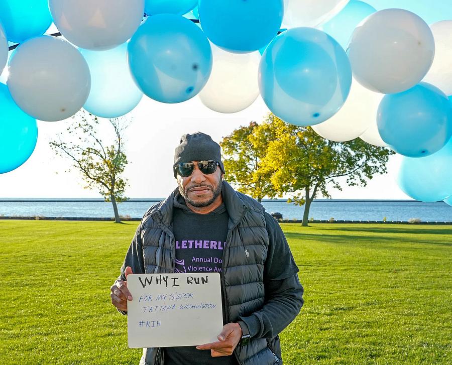 Image of a person holding a poster in outdoors