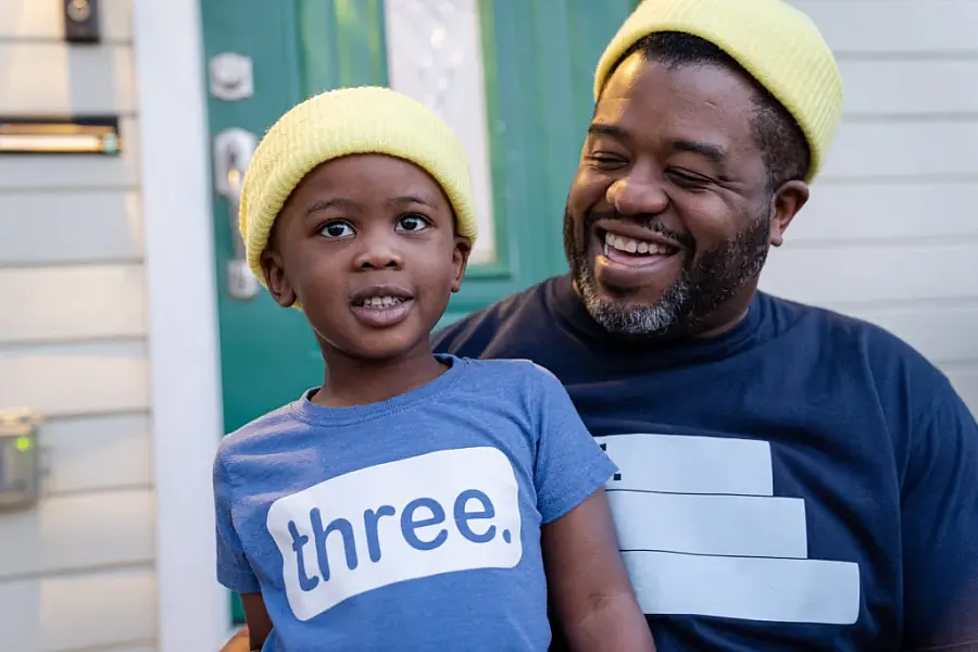 Two people in yellow caps
