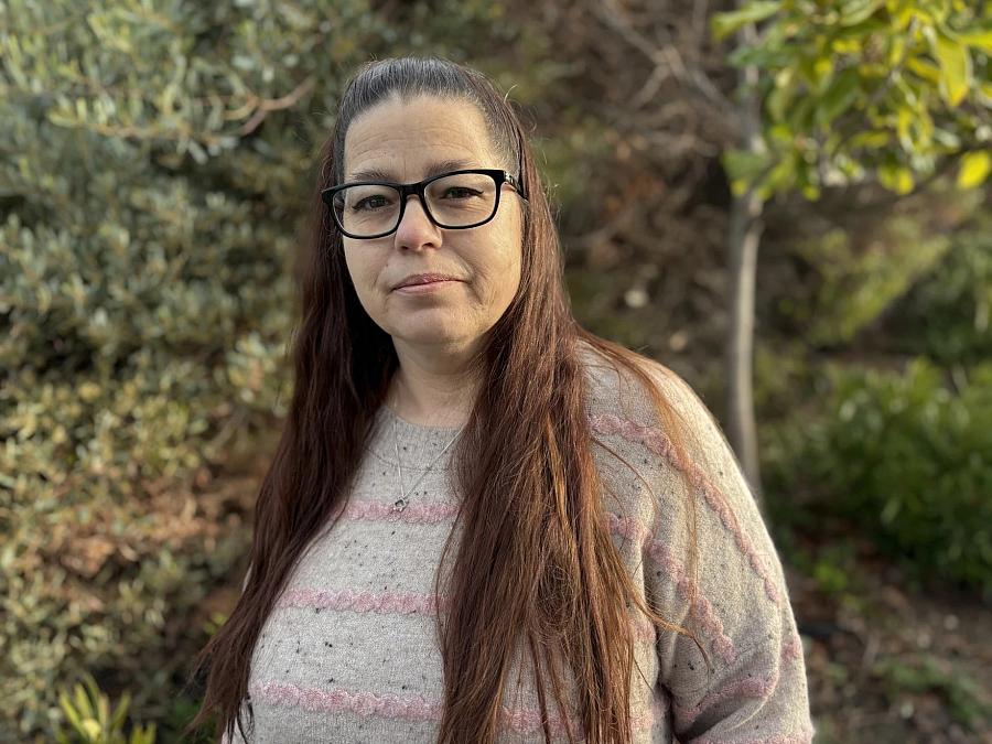 person standing in front of trees