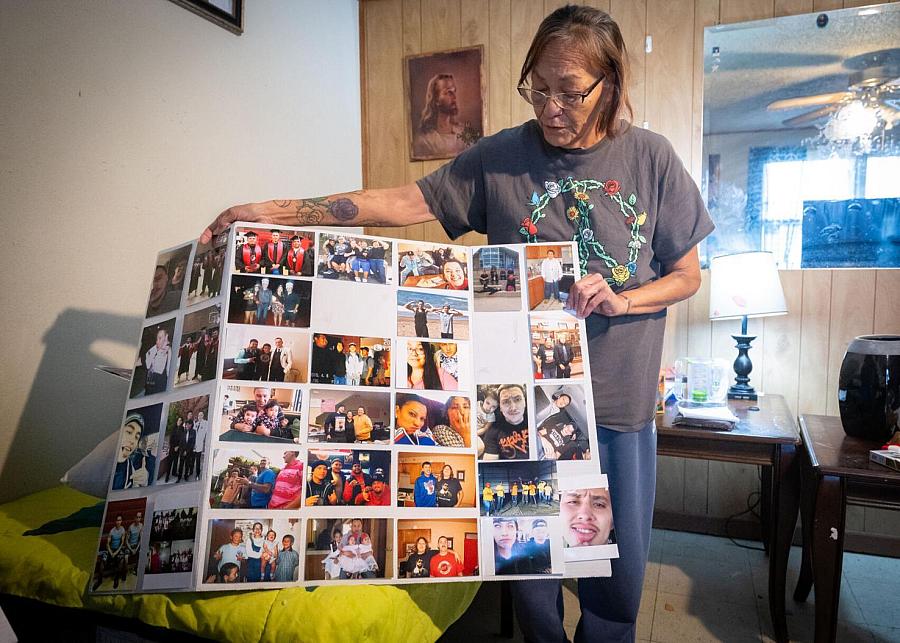 person holding poster of photographs