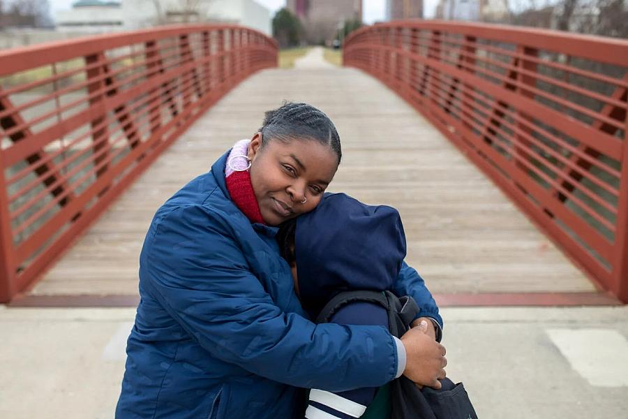 Person hugging child