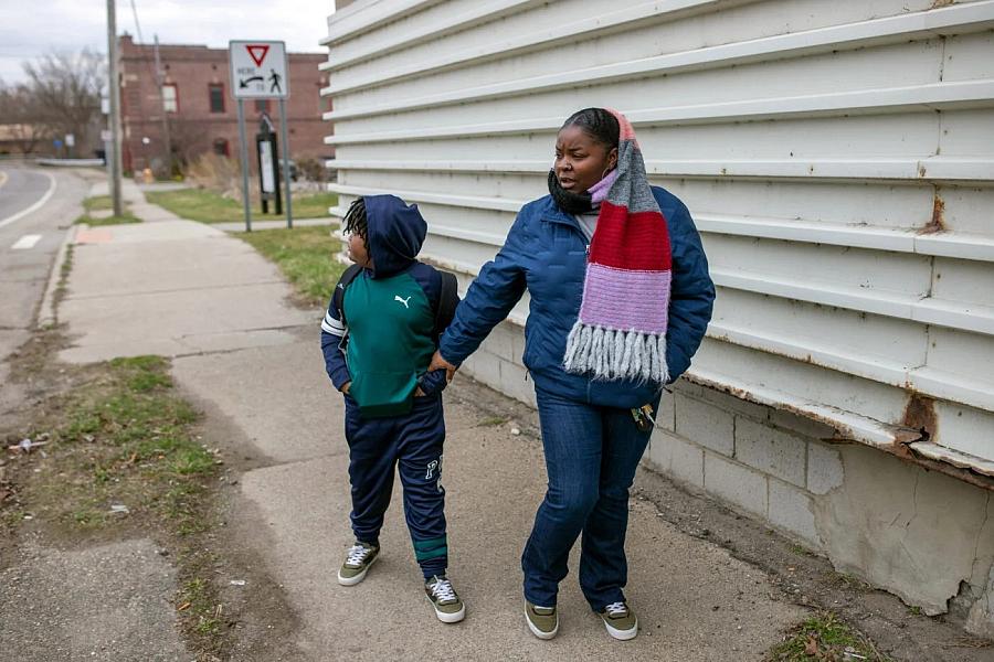 Person holding child's hand