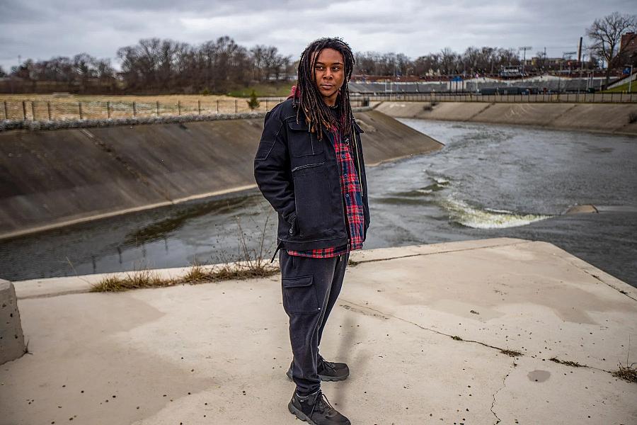 Person standing in front of a river