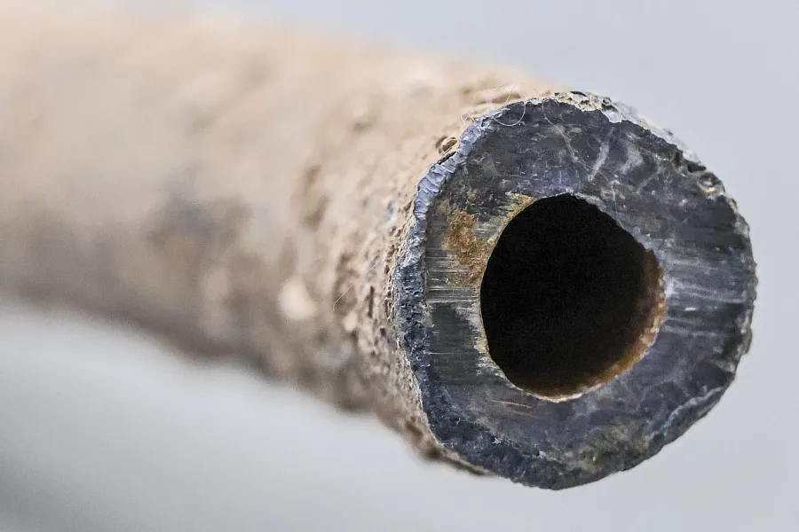 The end of a section of 5/8-inch lead pipe used as a residential supply line