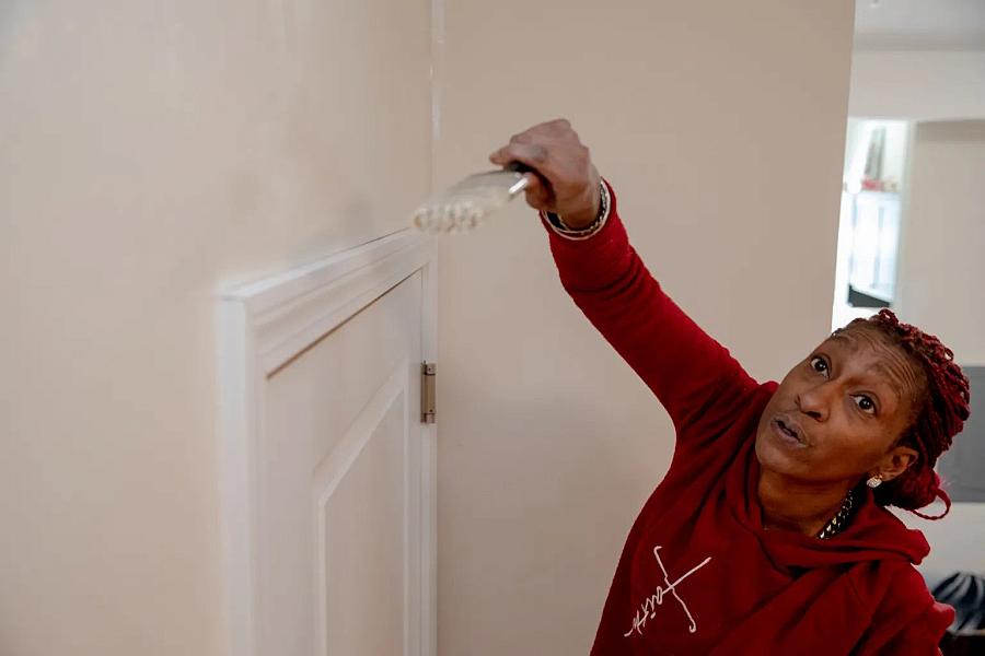 Person measuring the door's width