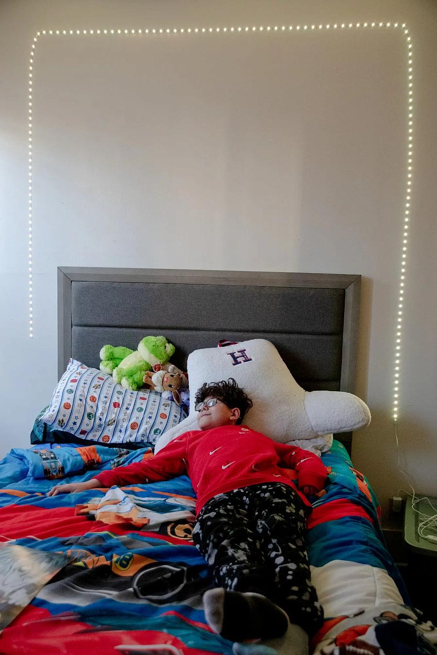 Kid lying on the bed