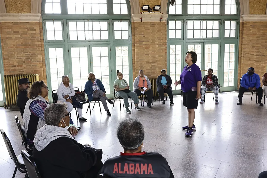 A person speaking at a meeting