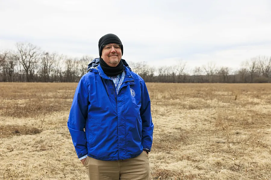 A person in blue coat