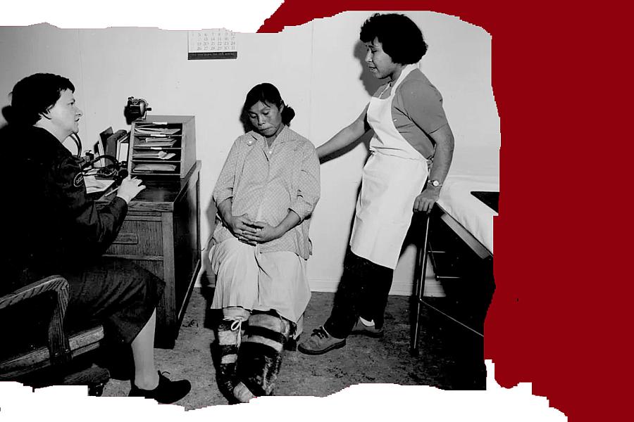 Three women in a clinic, one appears to be a patient