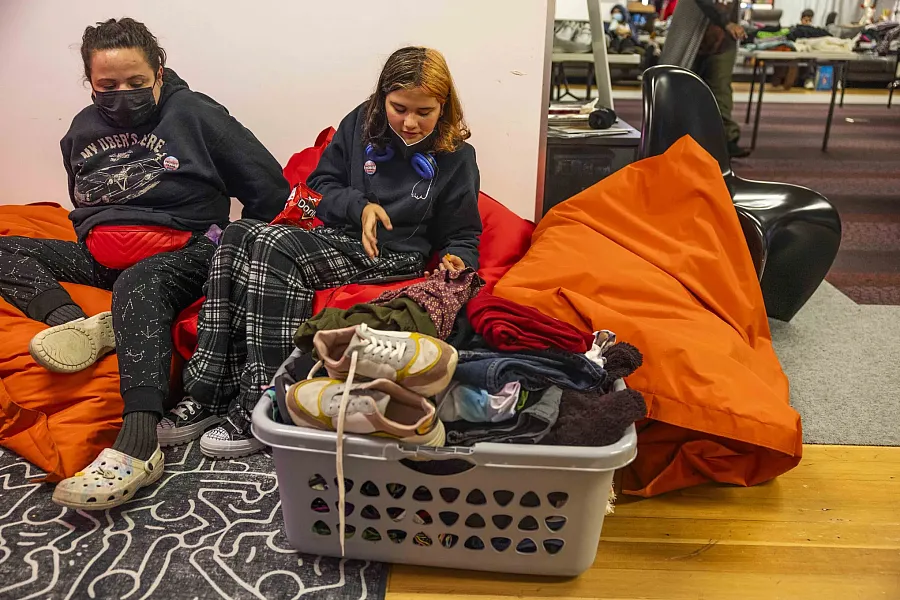 Image of two people sitting on floor