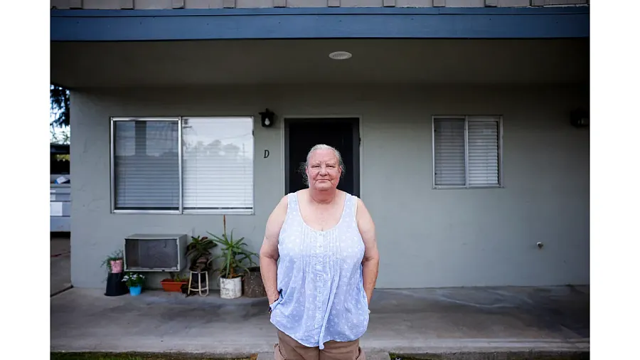 Person standing in front of a house