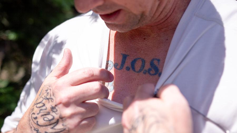 Person showing a tattoo