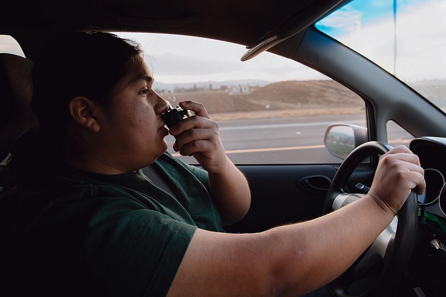A person in a car with a radio
