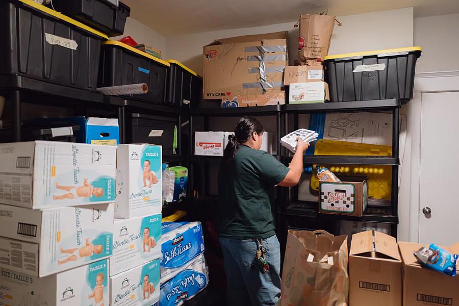 A person packing up flyers