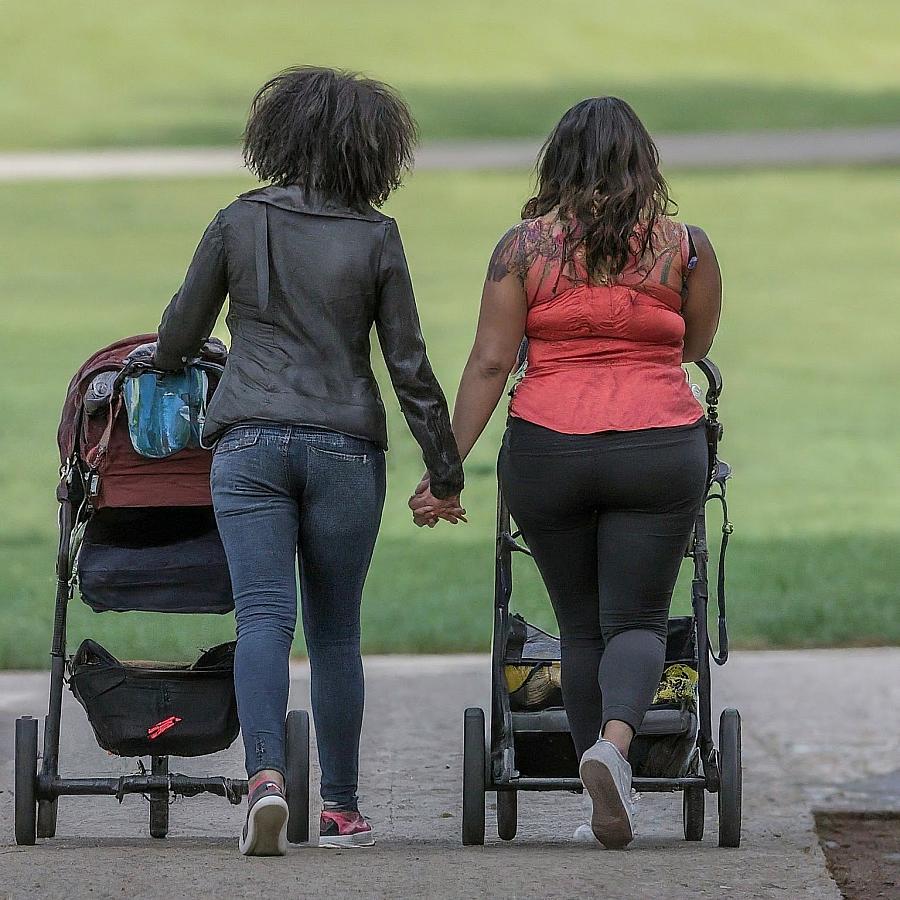 Image of two mother walking with their stroller