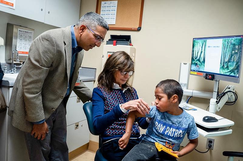 Six-year-old Abraham Gonzalez-Martinez at a checkup at UCLA in November 2019 along with clinicians Maria Garcia-Lloret (center) and Manish Butte (left). Read and listen to Kerry Klein's feature story following Abraham's treatment on KVPR Valley Public Radio. Credit: Nick Carranza/UCLA Health