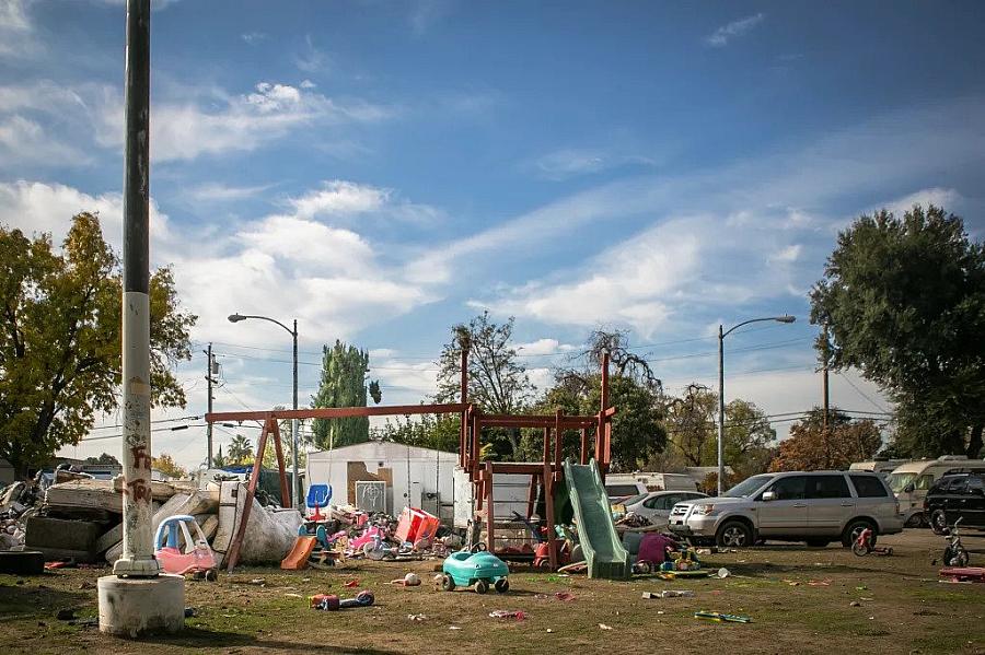 Garbage and discarded mattresses on a playground