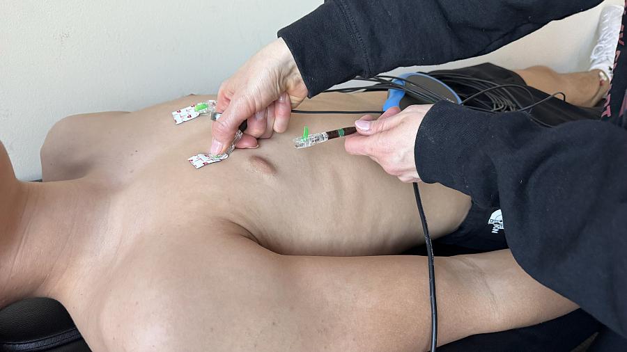 person getting medical devices attached to their chest