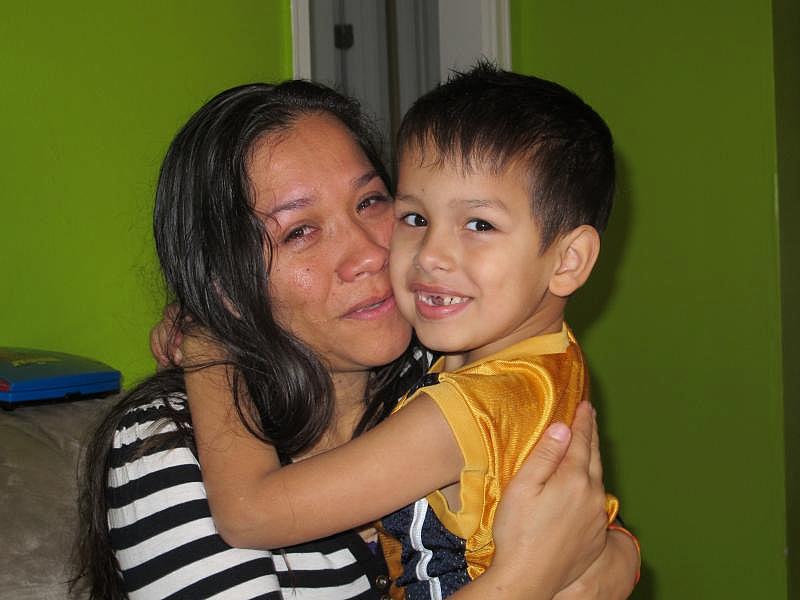 Reyna Paniagua with her son Kevin (6). (Johanes Rosello/MundoHispánico)