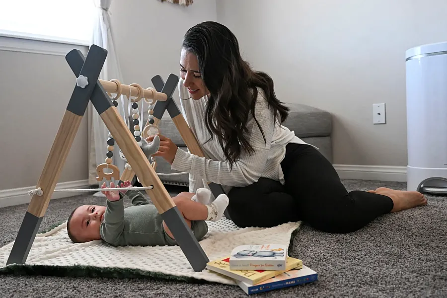 Person playing with a baby