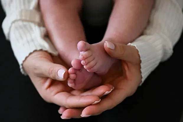 Person holding a baby
