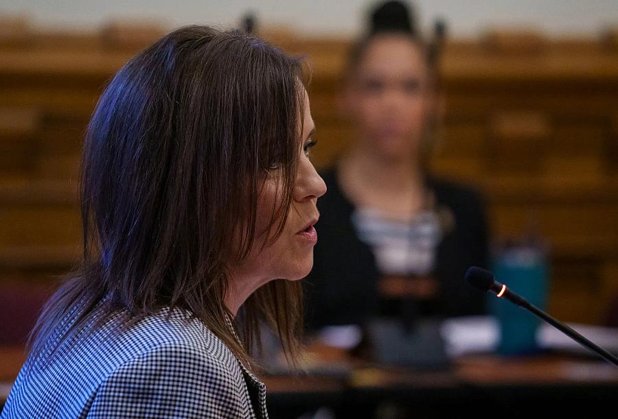 A woman speaking in a mic