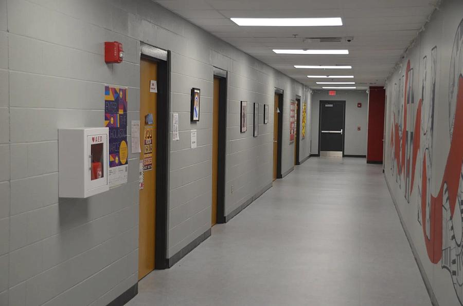 Image of an empty school hallway.